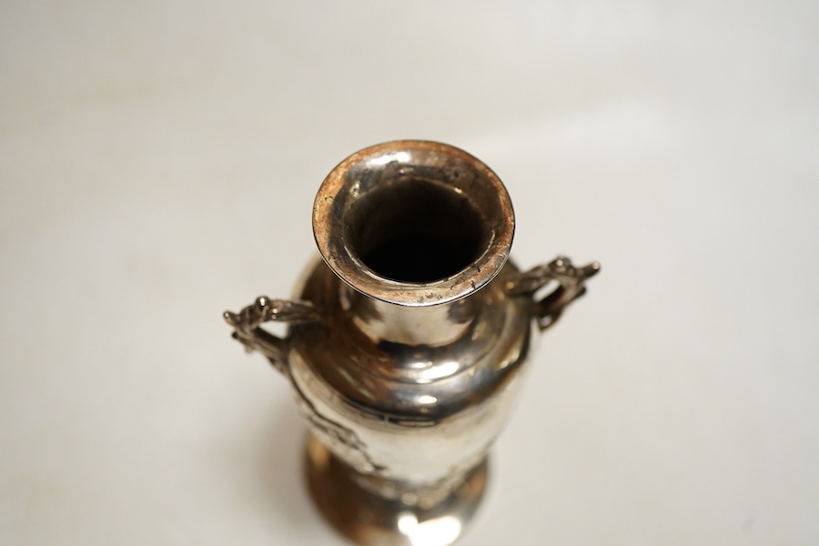 A Chinese export silver twin handed vase c.1900, stamped KC, artisans mark, decorated in relief with flowering prunus branches, height 13cm., weight approx. 4.72ozt